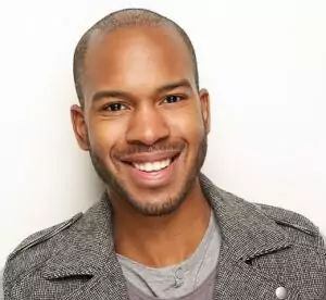 Man smiling into the camera with nice teeth from cosmetic dental treatment in Fort Collins